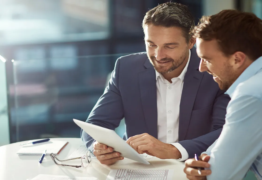 a man looking at a tablet
